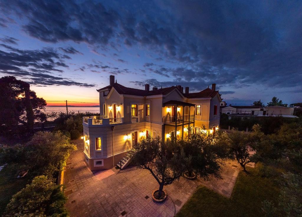 an aerial view of a house with lights at Sunset English Villas in Paralía