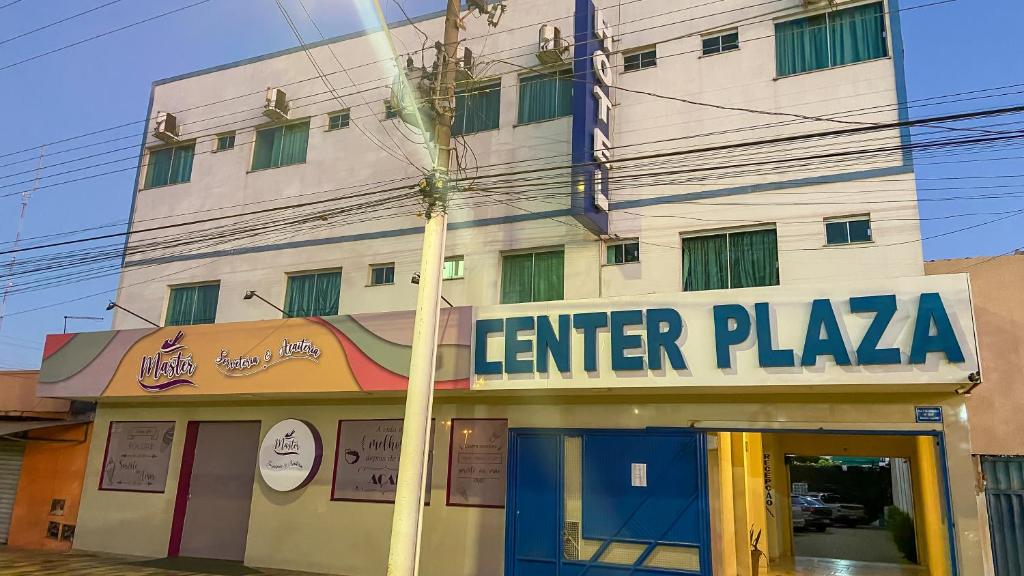 a building with a sign that reads enter plaza at CENTER PLAZA HOTEL in Cristalina