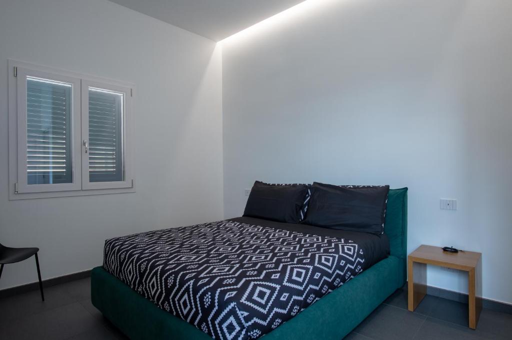 A bed or beds in a room at Il Giardino Antico