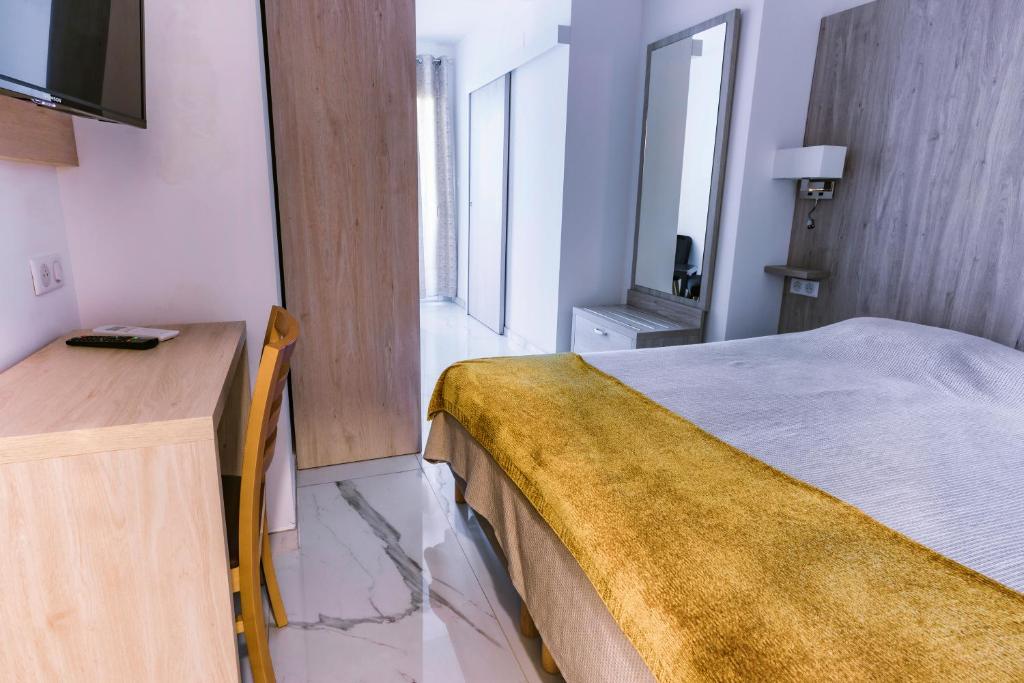 Postel nebo postele na pokoji v ubytování Hôtel Mare E Monti
