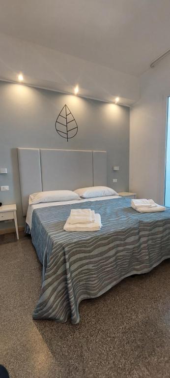 Postel nebo postele na pokoji v ubytování Hotel Caravel Park