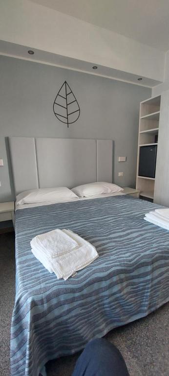 Postel nebo postele na pokoji v ubytování Hotel Caravel Park