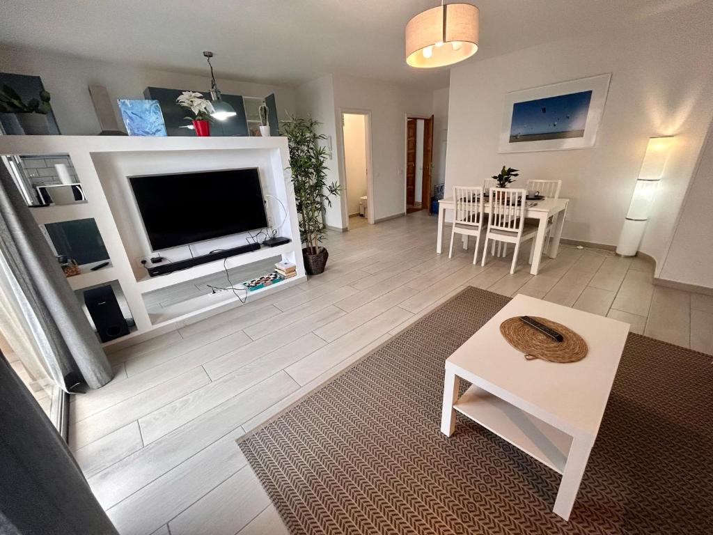 A television and/or entertainment centre at Alquilaencanarias- Medano Beach Tarajal