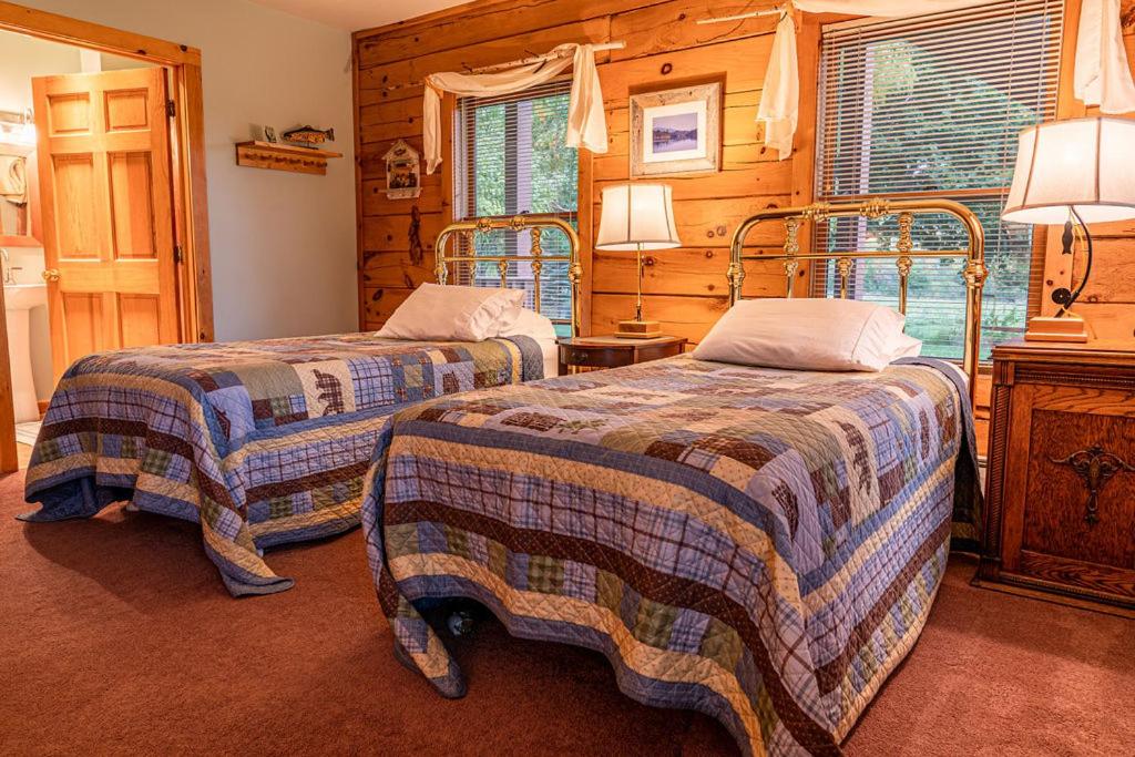 Voodi või voodid majutusasutuse Point Au Roche Lodge toas