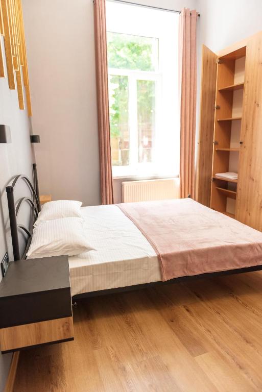 Postel nebo postele na pokoji v ubytování Apartments White Pearl Sadova