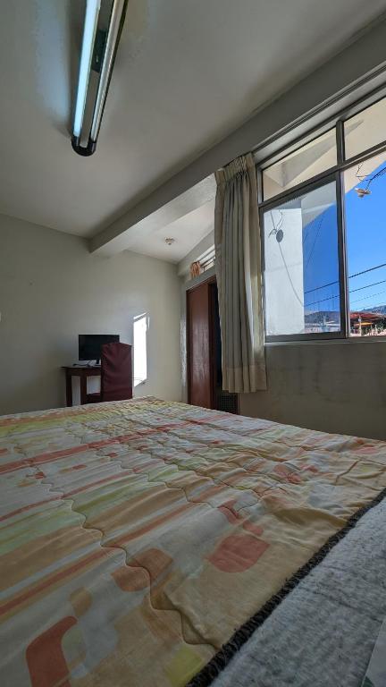 Postel nebo postele na pokoji v ubytování Hospedaje Arequipa