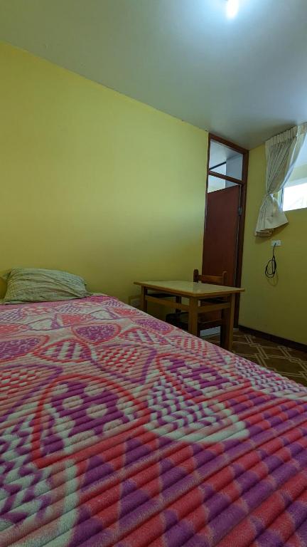 Postel nebo postele na pokoji v ubytování Hospedaje Arequipa
