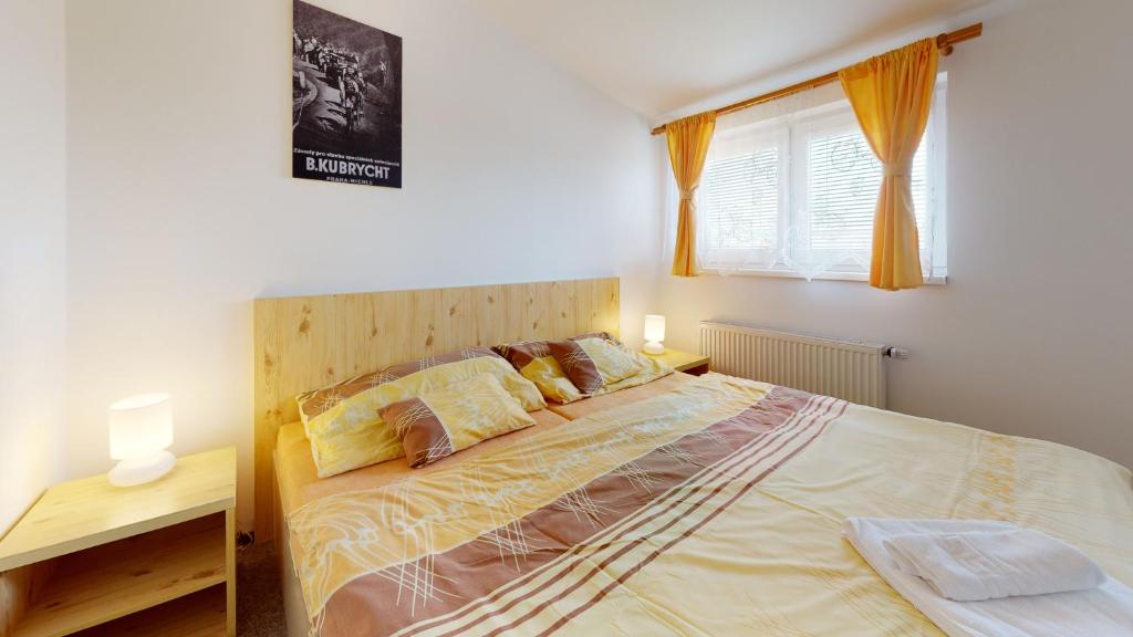 Postel nebo postele na pokoji v ubytování Penzion Pod kolem