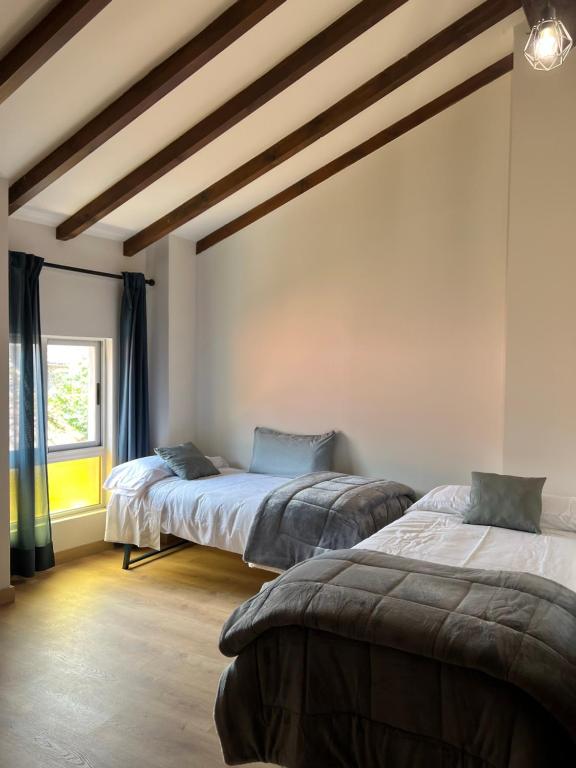 Ένα ή περισσότερα κρεβάτια σε δωμάτιο στο Casa en Treceño 5 Dormitorios y 2 Plantas