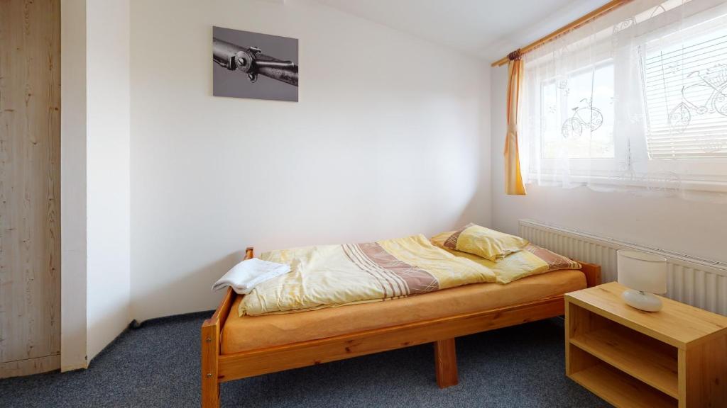 Postel nebo postele na pokoji v ubytování Penzion Pod kolem