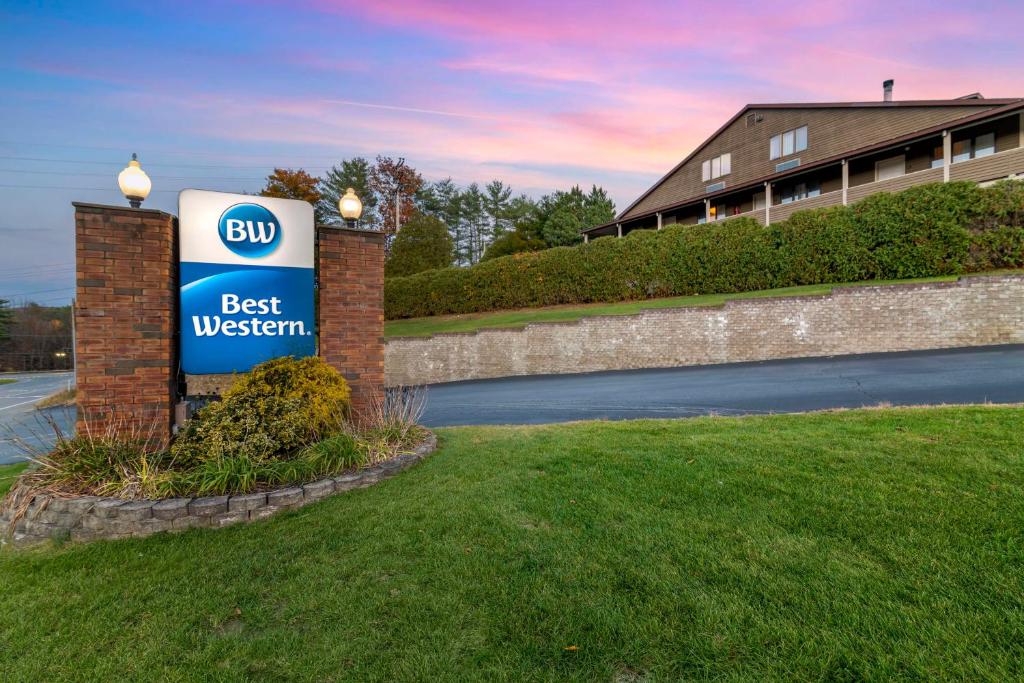 a best western sign in front of a building at Best Western of Lake George in Lake George