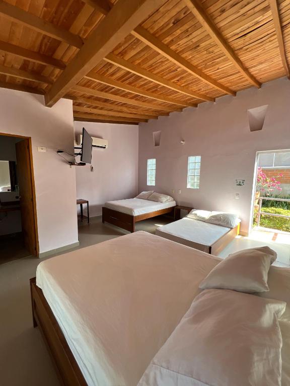Postel nebo postele na pokoji v ubytování Hotel Parador del Gitano