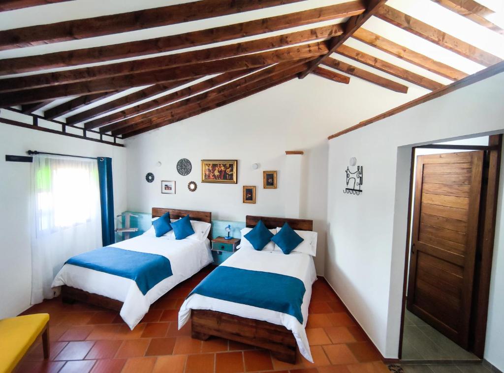 Postel nebo postele na pokoji v ubytování Casa El Retiro - Villa de Leyva