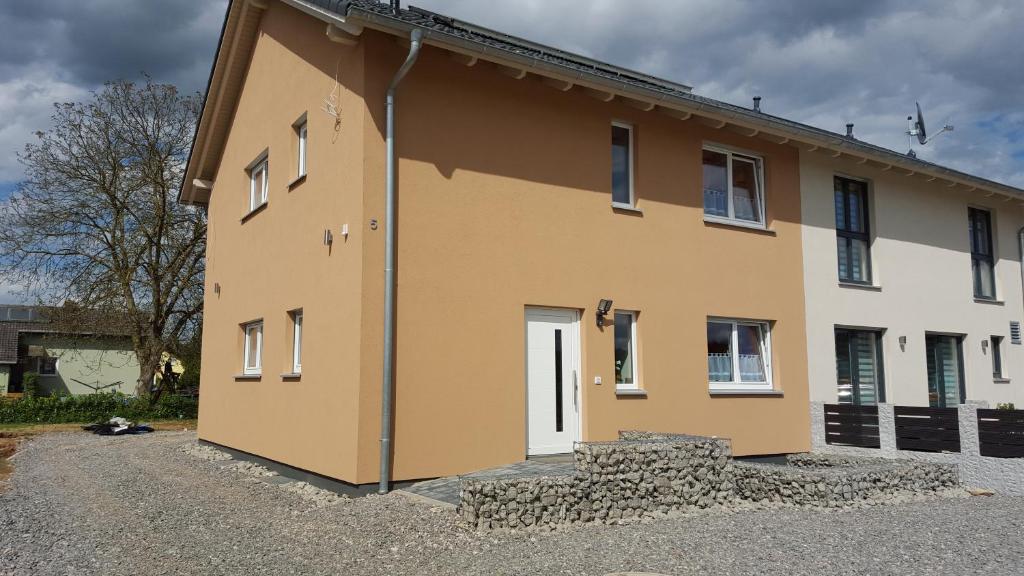 a large building with a white and brown at BeHappy in Rust