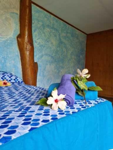 Postel nebo postele na pokoji v ubytování marari rapa nui