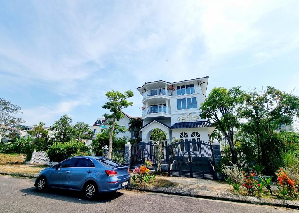 a blue car parked in front of a house at Promotion summer vacation, Ocean Villa Nha Trang 600m2 with 7 Bedrooms, Karaoke, BBQ in Nha Trang