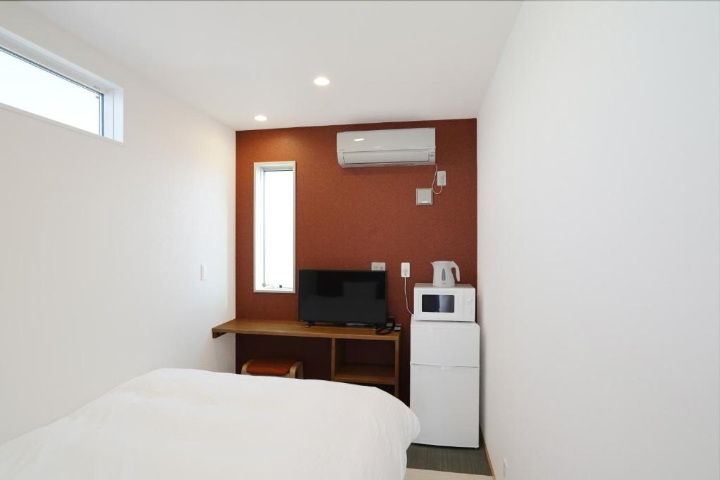 Kuchyň nebo kuchyňský kout v ubytování Hotel Cradle Cabin Tateyama