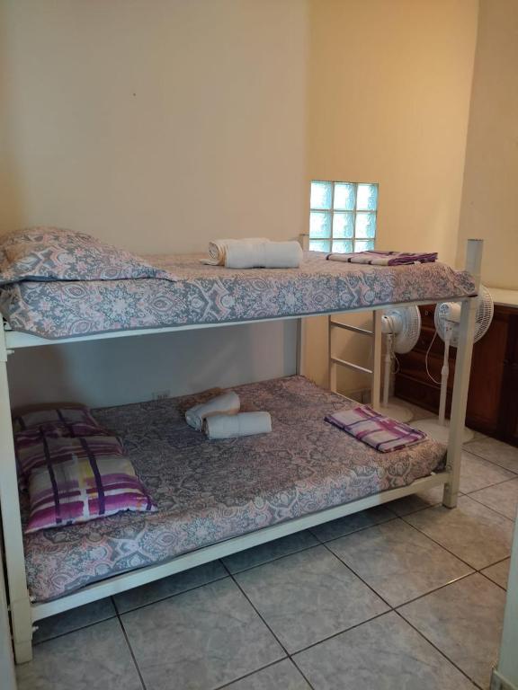 Postel nebo postele na pokoji v ubytování Cabañas El Valle