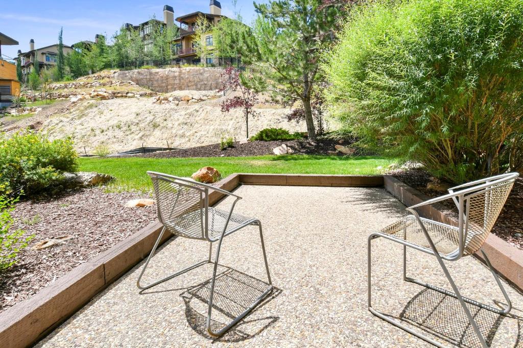 two metal chairs sitting on the ground in a yard at Sundial Lodge, Park City - Canyons Village by Vail Resorts in Park City