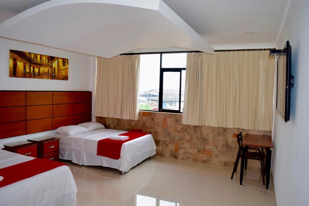Postel nebo postele na pokoji v ubytování Hotel Apart Guayaquil Aeropuerto