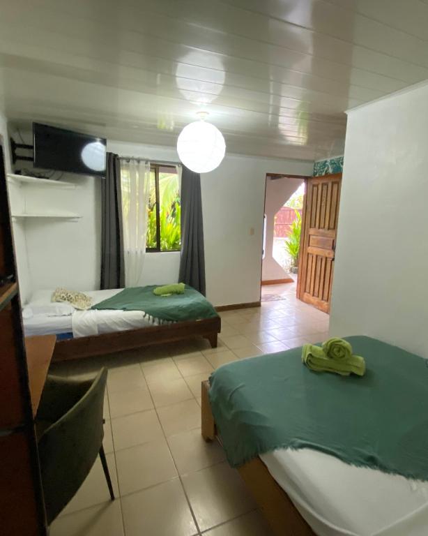 Postel nebo postele na pokoji v ubytování Cabinas Cahuita
