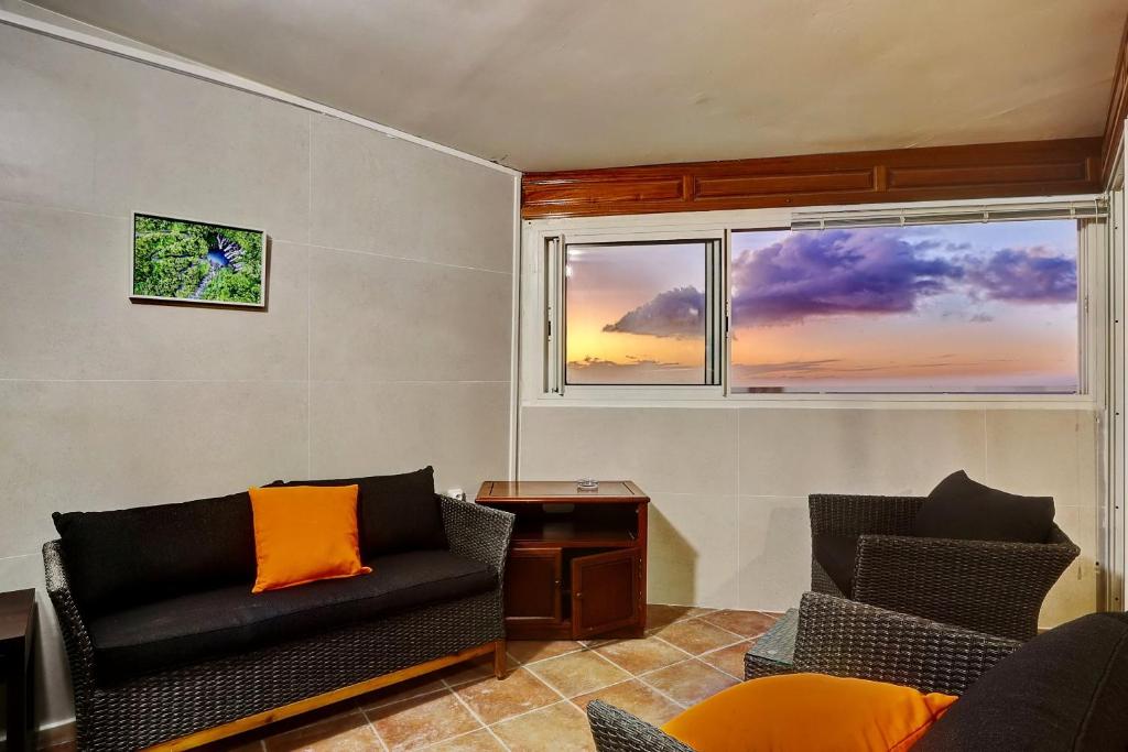 Posezení v ubytování Vaste chambre vue mer montagne Ti Kaz Miyou 3