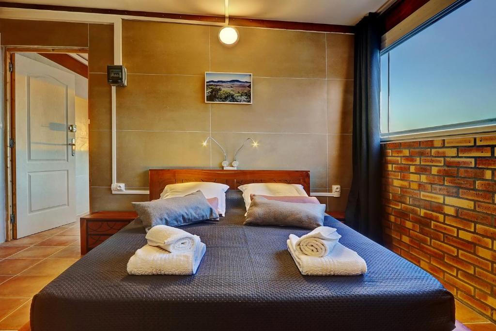 Postel nebo postele na pokoji v ubytování Vaste chambre vue mer montagne Ti Kaz Miyou 3