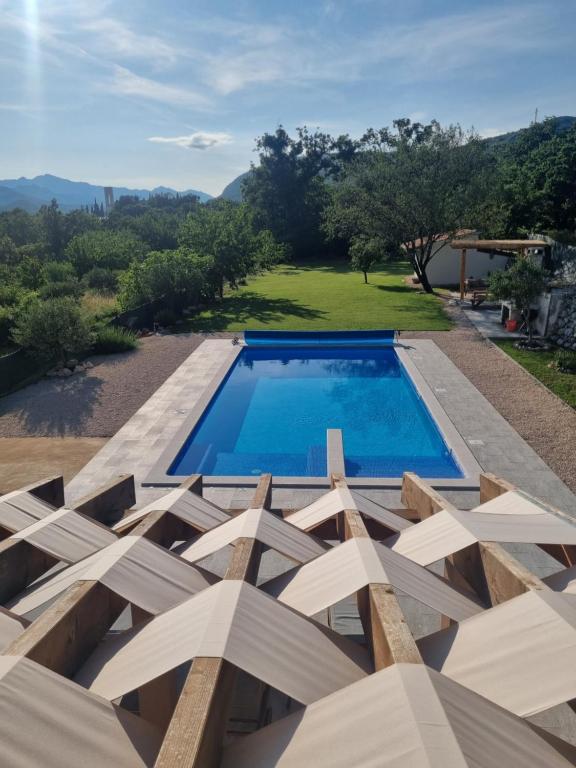 a swimming pool on top of a house at Villa MirIva in Katuni