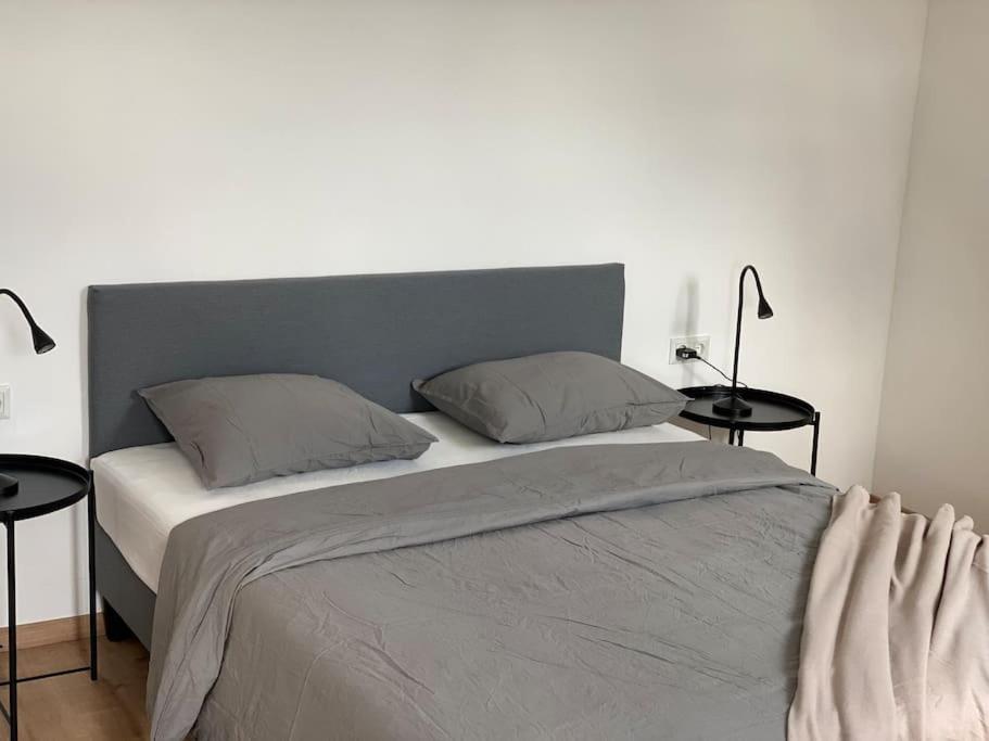 Postel nebo postele na pokoji v ubytování Gemütliche Wohnung nähe Klagenfurt