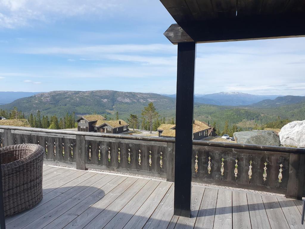 a balcony with a view of a mountain at Wonderful cabin with amazing mountain - view in Lifjell