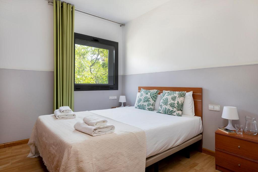 Postel nebo postele na pokoji v ubytování Apartments Sata Park Guell Area