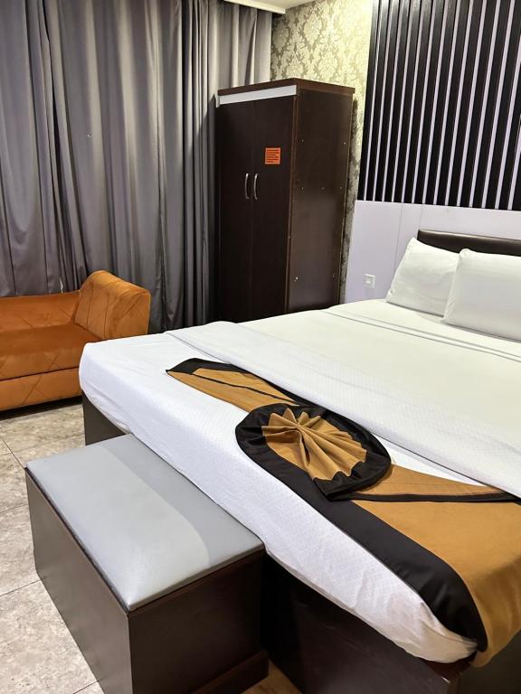 Postel nebo postele na pokoji v ubytování Msquare Hotel GRA