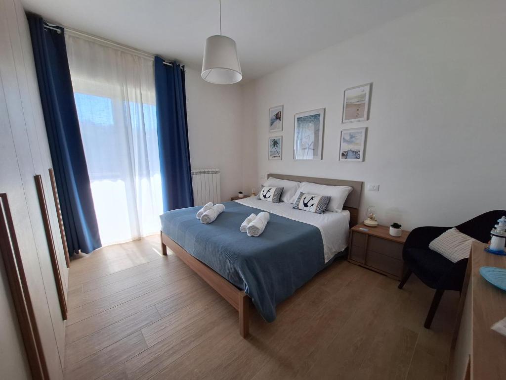 a bedroom with a bed with two towels on it at B&B Stella Di Mare - Ortona in Ortona