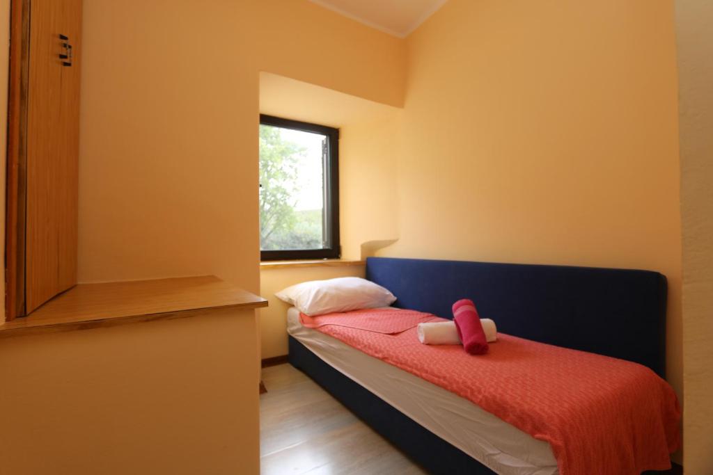 Łóżko lub łóżka w pokoju w obiekcie House Zbasnik