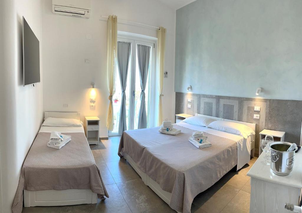 Postel nebo postele na pokoji v ubytování Hotel Marconi