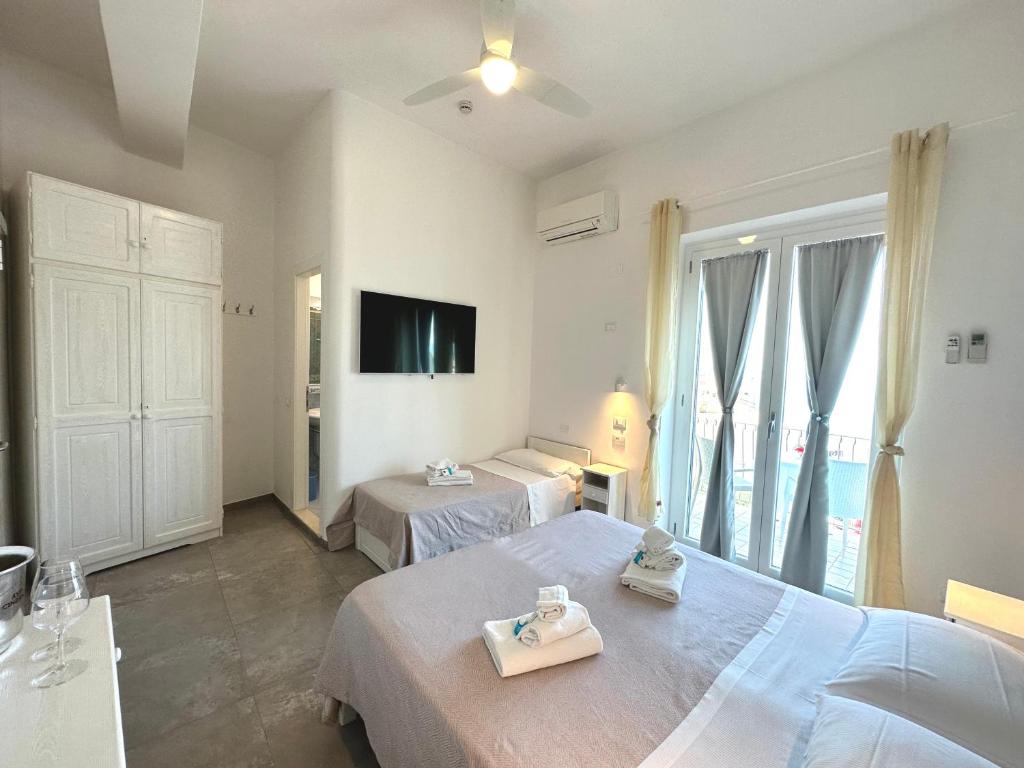 Postel nebo postele na pokoji v ubytování Hotel Marconi