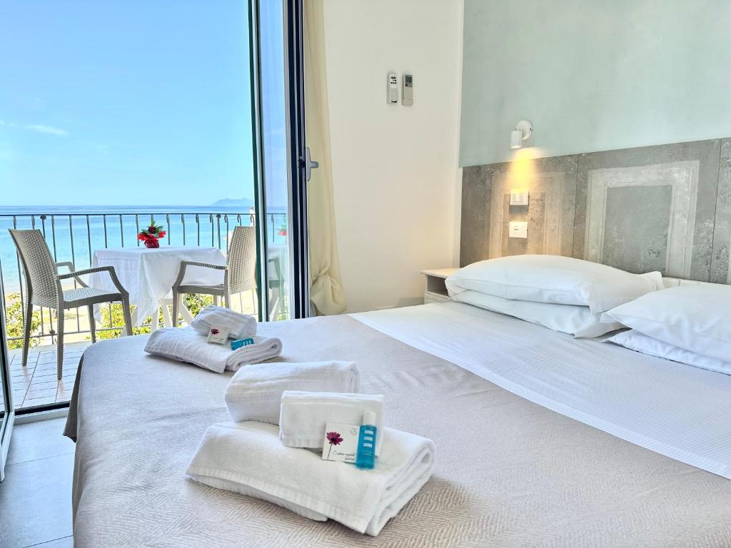 Postel nebo postele na pokoji v ubytování Hotel Marconi
