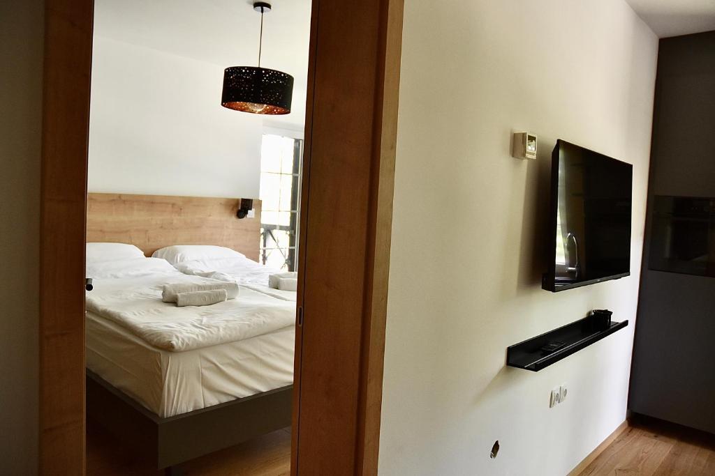 Postel nebo postele na pokoji v ubytování Olimian Oasis Village Lipa 107