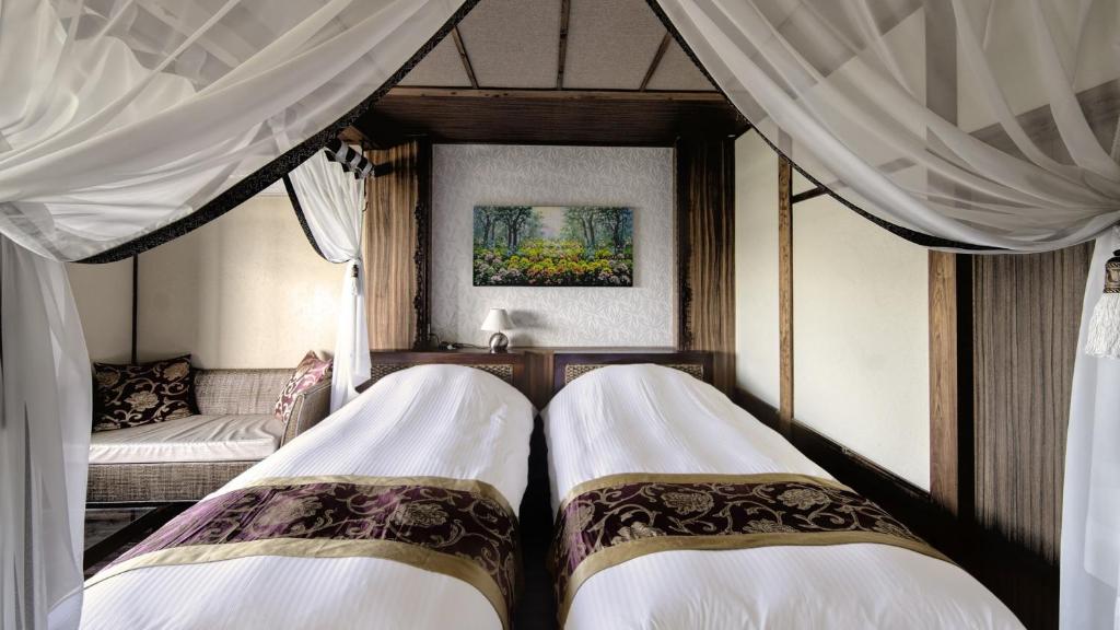 Postel nebo postele na pokoji v ubytování Bali Resort SAYA no Kaze
