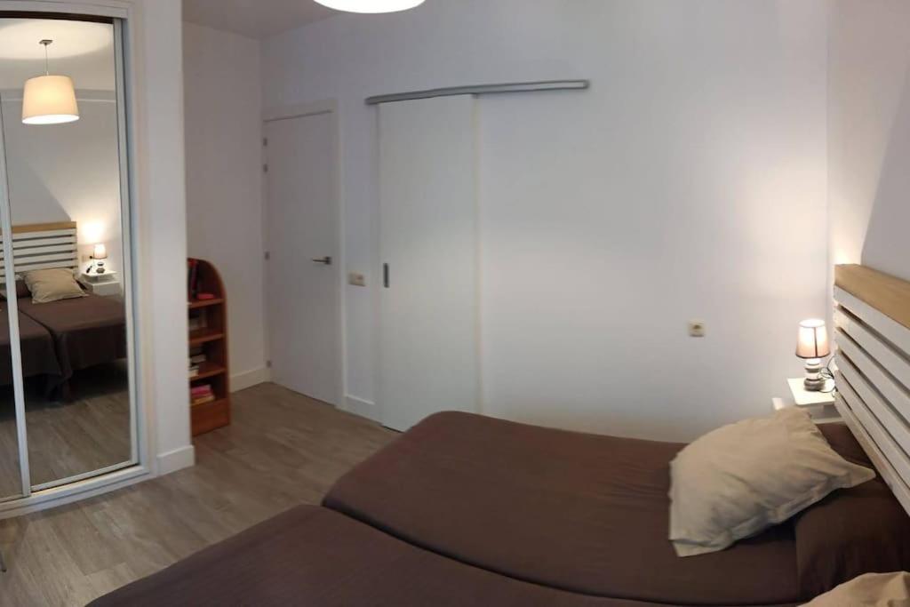 Posteľ alebo postele v izbe v ubytovaní Acogedor y precioso apartamento + parking privado