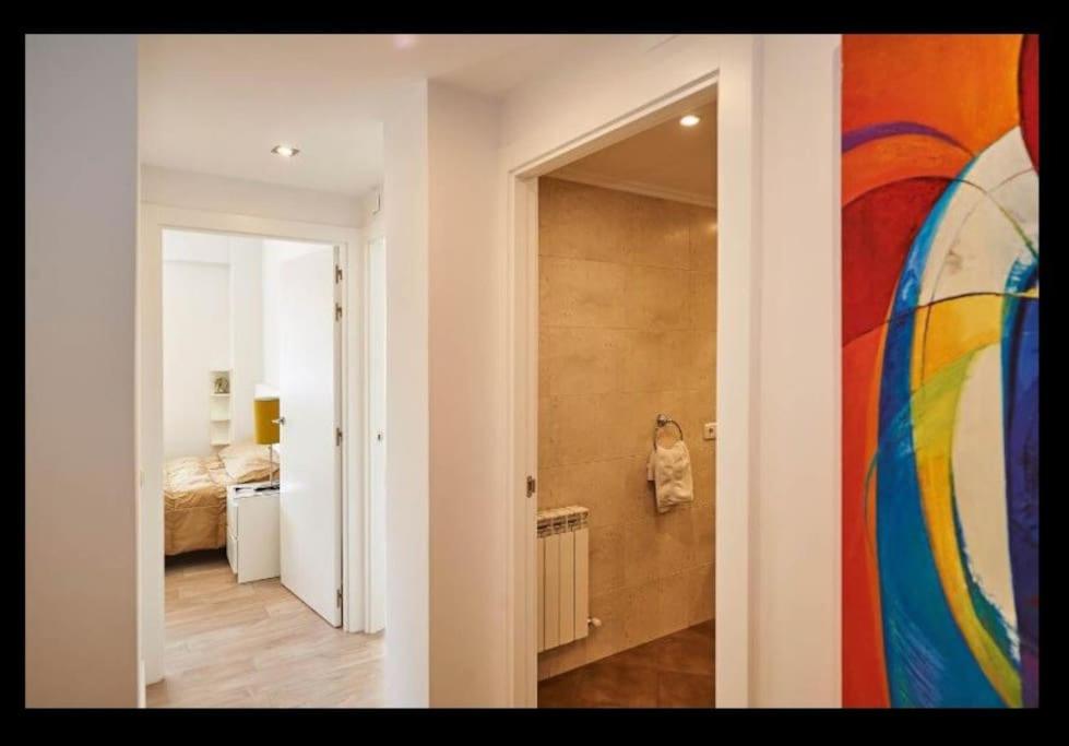 Posteľ alebo postele v izbe v ubytovaní Acogedor y precioso apartamento + parking privado