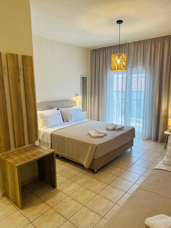 Postel nebo postele na pokoji v ubytování Pella Hotel - new