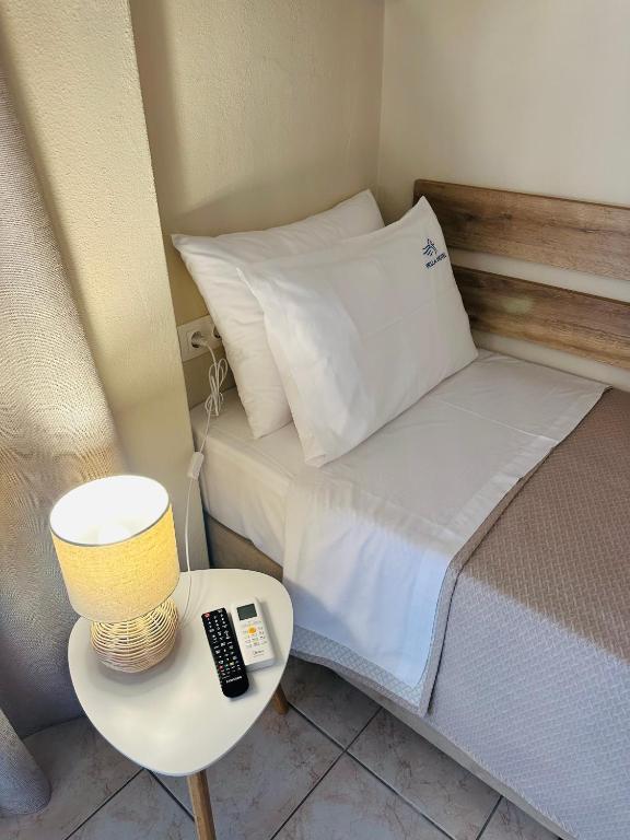 Postel nebo postele na pokoji v ubytování Pella Hotel - new