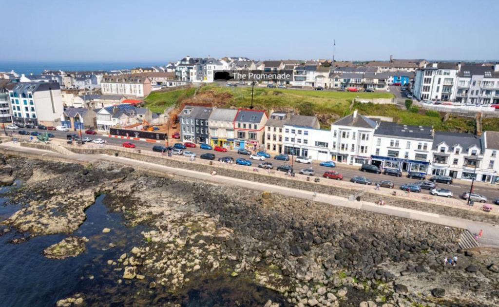 an aerial view of a city with a bridge over the water at Promenade Apartment Panoramic sea Views Portstewart in Portstewart