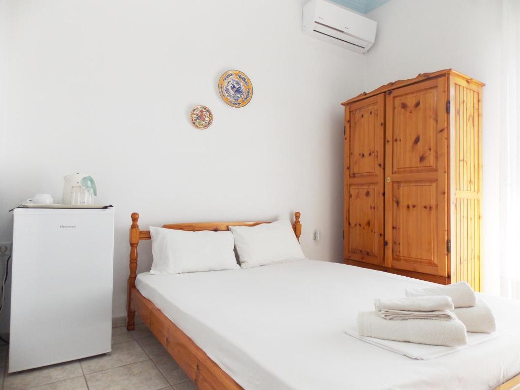 Postel nebo postele na pokoji v ubytování Hotel Sgouridis