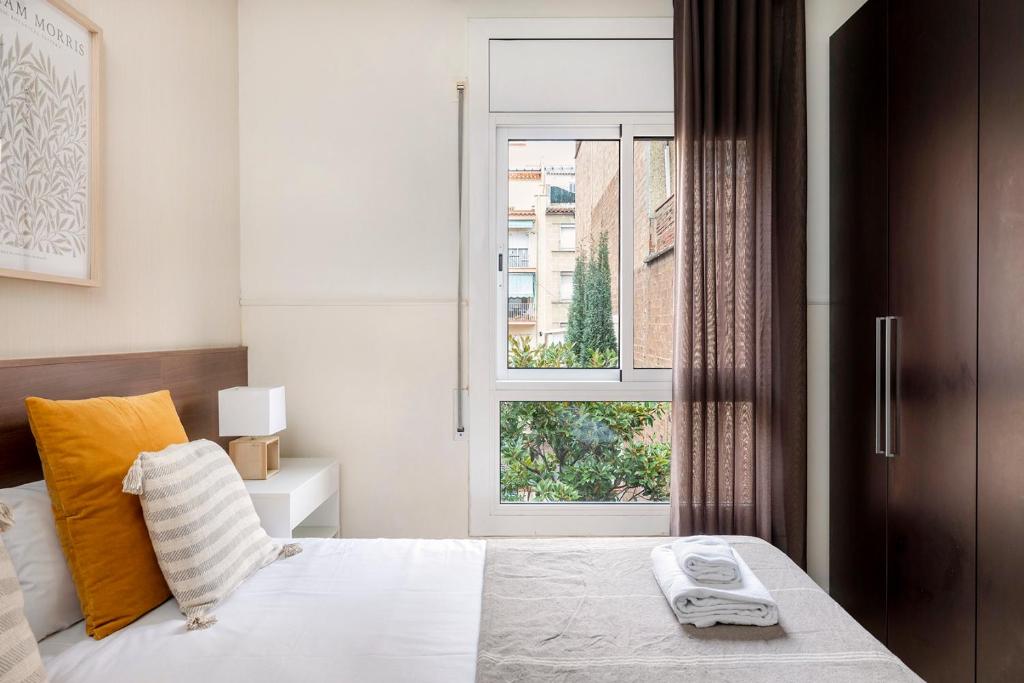 Posteľ alebo postele v izbe v ubytovaní Apartments Sata Sagrada Familia Area