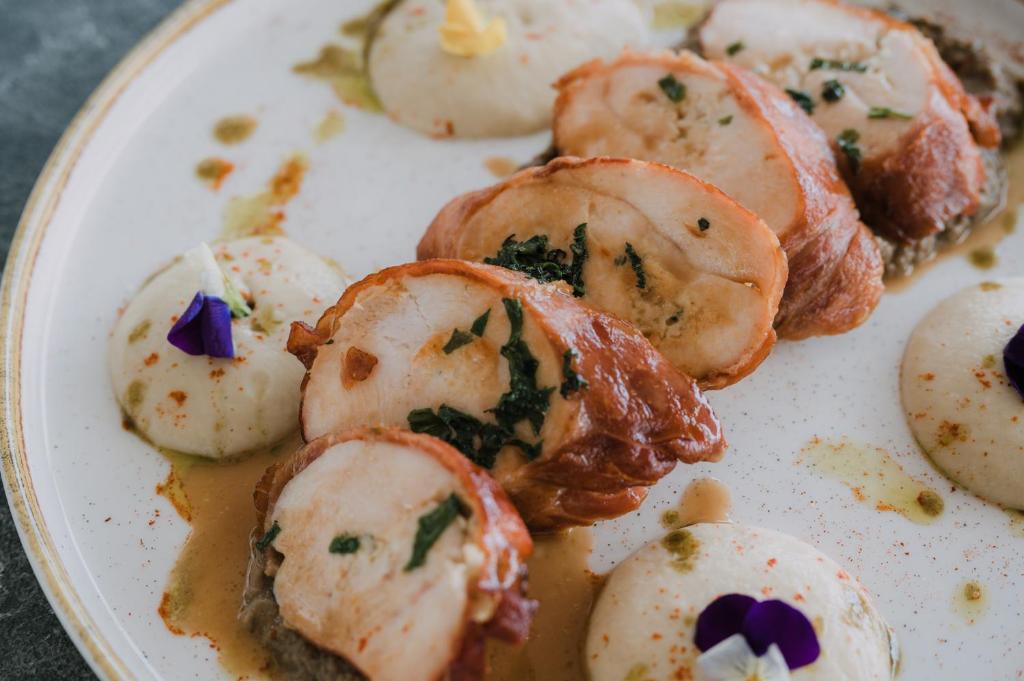 a plate of food with scallops on it at Agamemnon Hotel in Nafplio