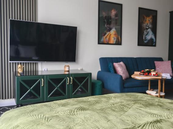 A television and/or entertainment centre at Nessebar Fort Club - Prestige Apartments