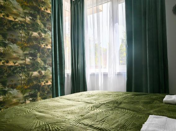 A bed or beds in a room at Nessebar Fort Club - Prestige Apartments