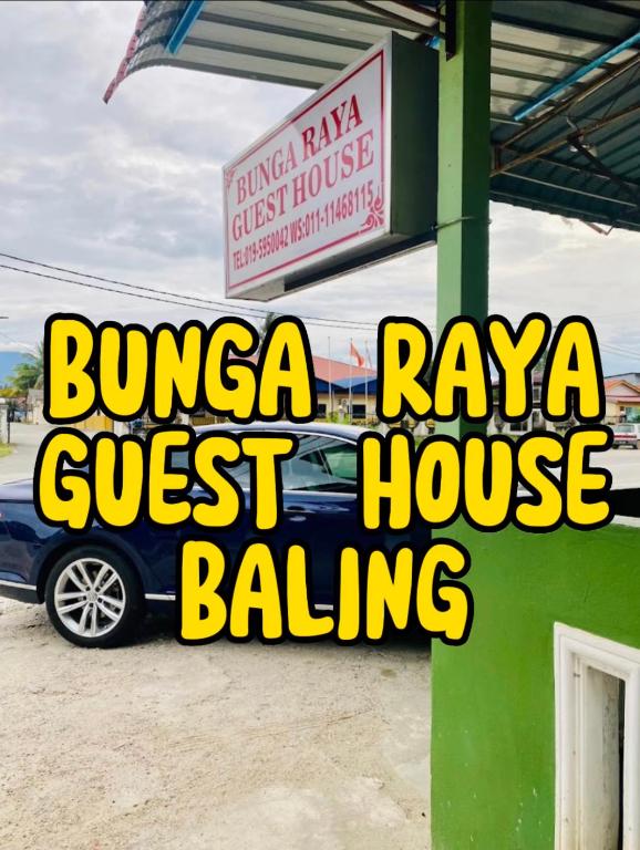 a sign for a bunya freeway guest house building at Bunga Raya Guest House BALING in Baling